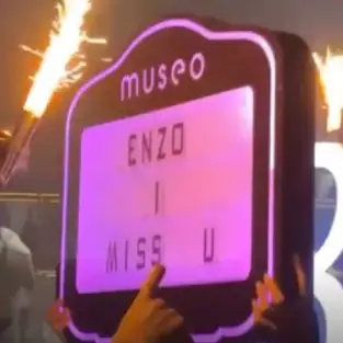 Leicester players party in a nightclub with a sign bearing the words 'Enzo I miss you'